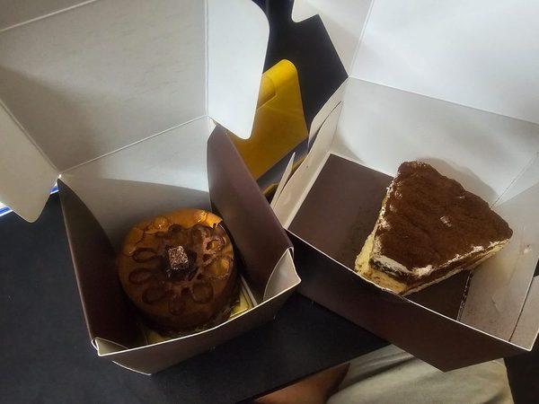 An orange chocolate cake and a tiramisu slice from Nuha